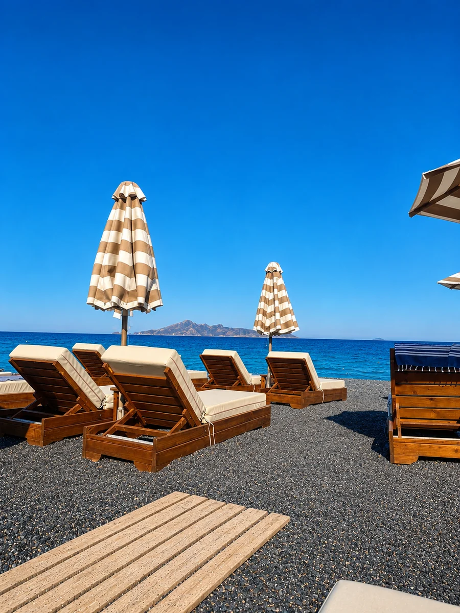 Black volcanic beach and clear waters at Kamari